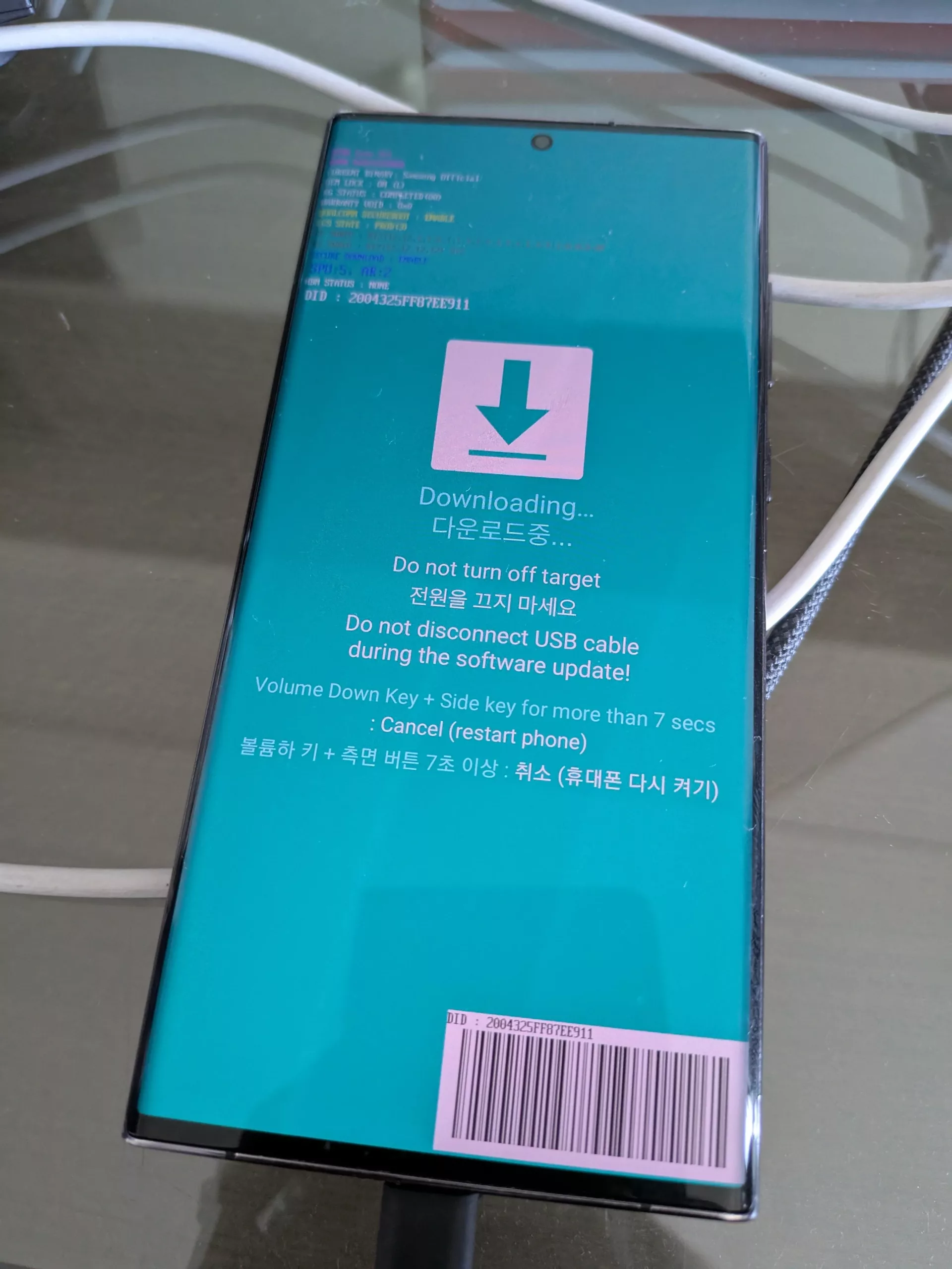 Samsung Galaxy S22 smartphone stuck in a boot loop on a desk.